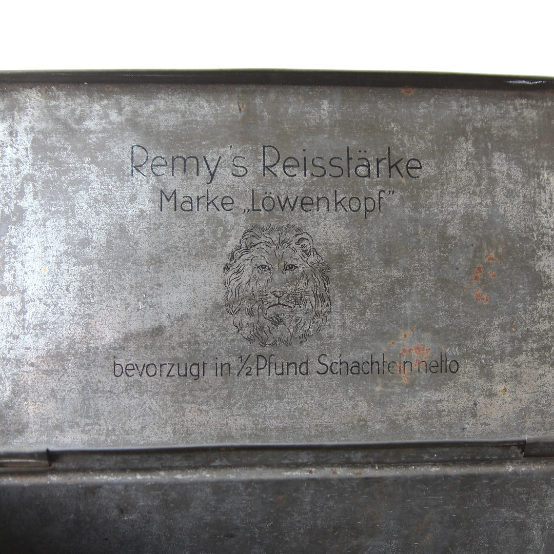 Blechdose „Remy's Reissstärke Marke Löwenkopf“ – 1920er–1930er Jahre