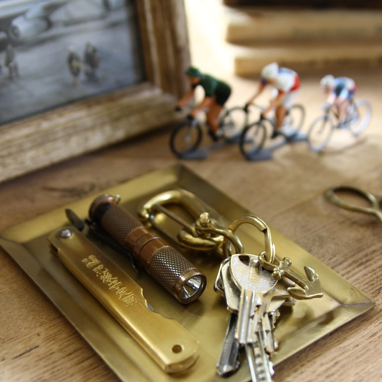 Minimal rectangular brass tray on desk