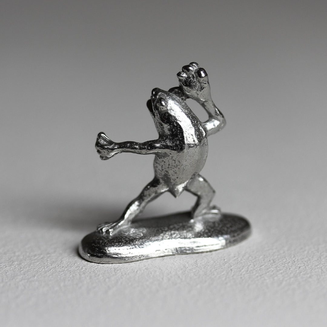Side view of the Chōjū-giga frog incense holder in pewter
