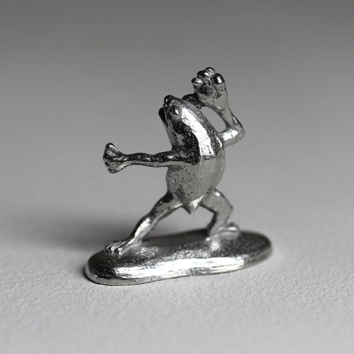 Side view of the Chōjū-giga frog incense holder in pewter