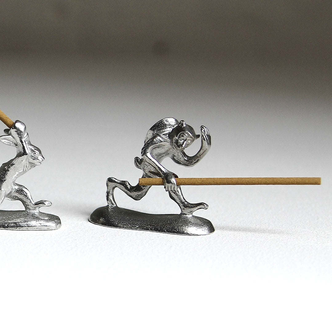 Chōjū-giga monkey pewter incense holder with incense stick by Sumitani Saburo Shoten