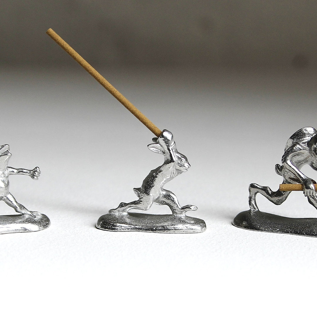 Chōjū-giga rabbit pewter incense holder with incense stick by Sumitani Saburo Shoten