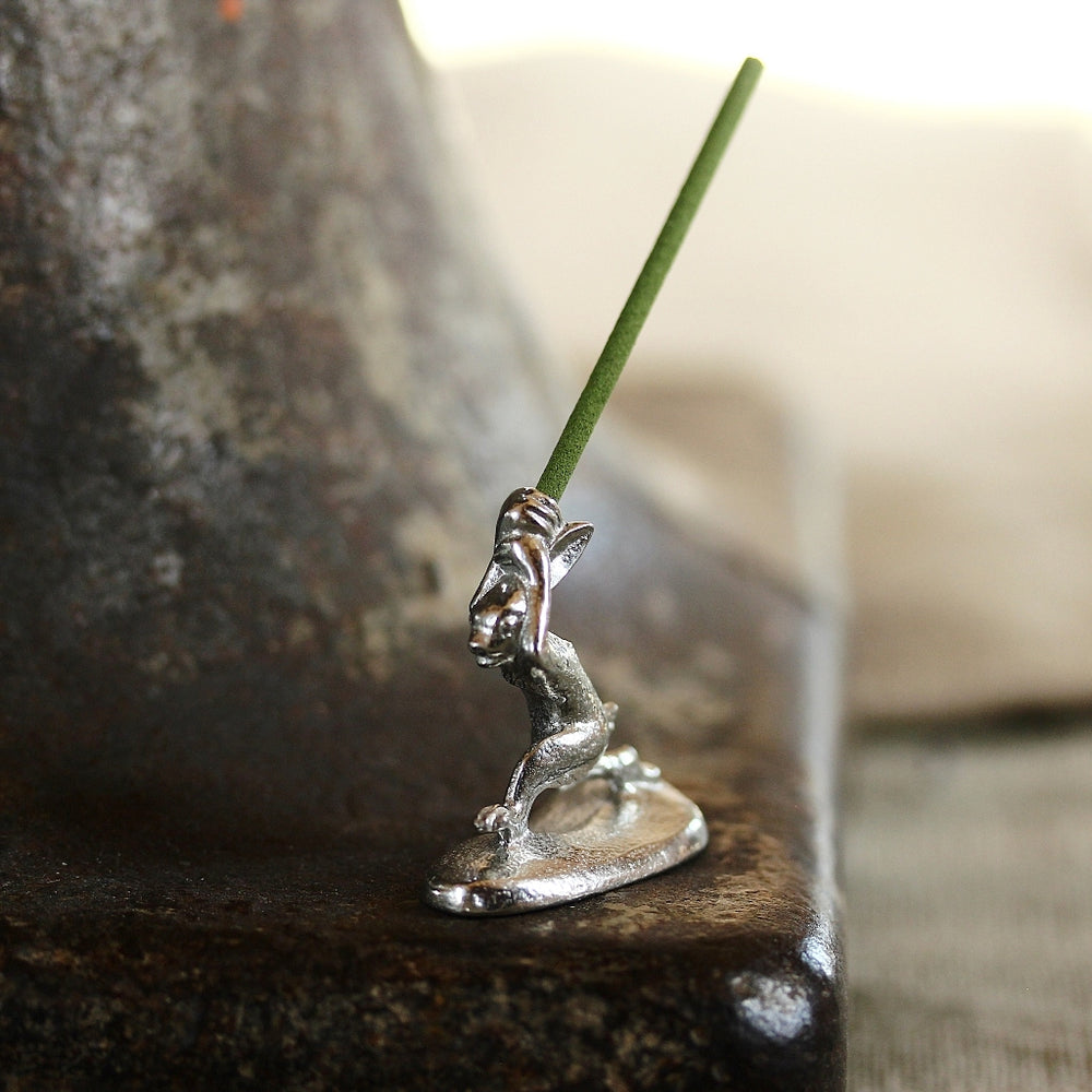 Side view of the Chōjū-giga rabbit incense holder in pewter