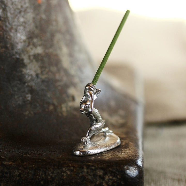 Side view of the Chōjū-giga rabbit incense holder in pewter